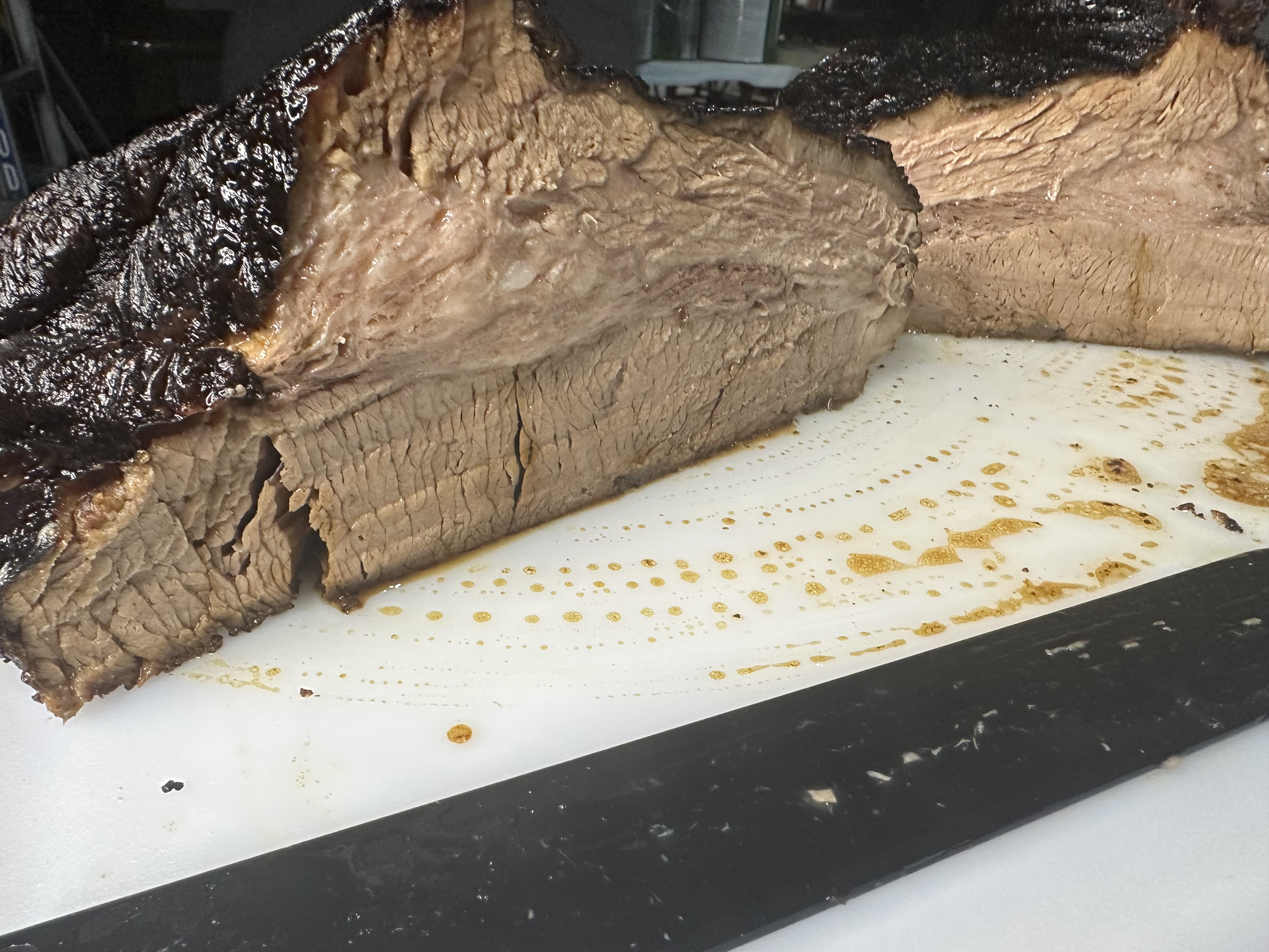 Perfectly sliced brisket with smoke ring